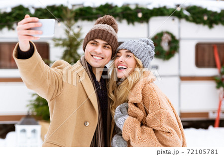 Romantic Selfie. Loving Young Couple Talking Self-Portrait With Smartphone On Winter Day Romantic Selfie. Loving Young Couple Talking Self-Portrait With Smartphone On Winter Day 72105781