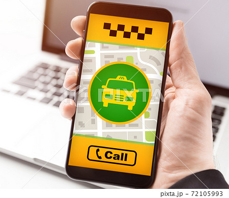 Man holding smartphone with taxi app interface 72105993