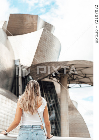 Woman visiting the Guggenheim museum in Bilbao Woman visiting the Guggenheim museum in Bilbao 72107082