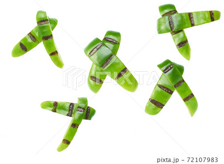 grilled sliced green bell pepper isolated on white background. Top view. grilled sliced green bell pepper isolated on white background. Top view. 72107983