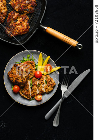 Pork fillet baked in oven with seasoning and herbs 72108668