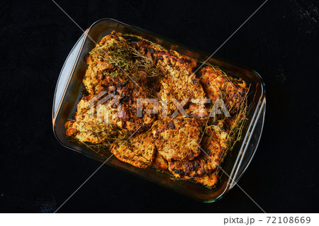 Pork fillet baked in oven with seasoning and herbs 72108669