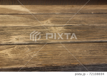 Old wooden planks with rusty nails driven in. Selective focus. Wood texture. Wooden background Old wooden planks with rusty nails driven in. Selective focus. Wood texture. Wooden background 72108694