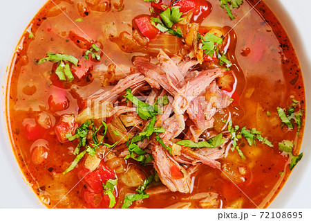 Close up view of thick, spicy and sour soup with beef 72108695