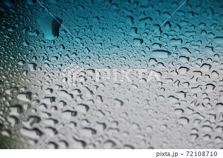 Blue water drops on ocean blue to silver gray gradient background 72108710