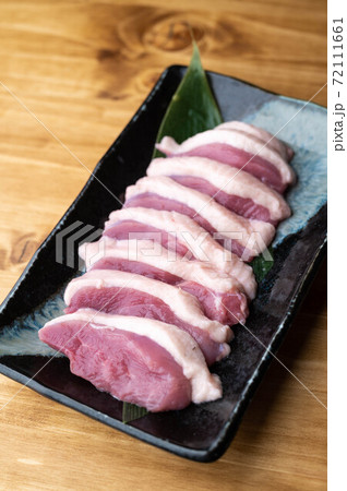 sliced raw duck meat on japanese dish sliced raw duck meat on japanese dish 72111661