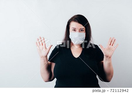 Confused shy clueless woman in medical mask Confused shy clueless woman in medical mask 72112942