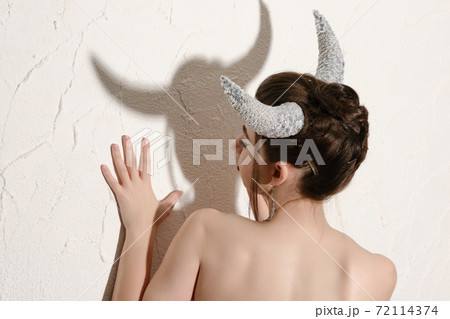 woman with horns 72114374