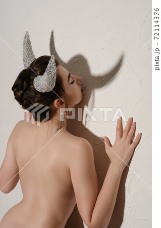 woman with horns 72114376