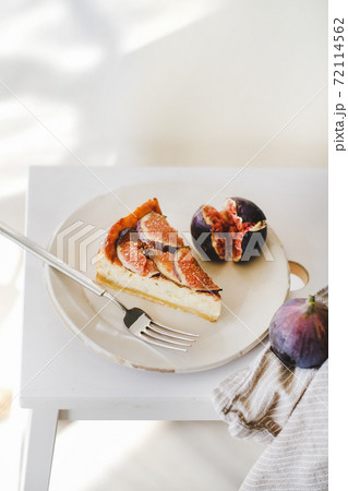 Piece of homemade fig cheesecake with fresh figs 72114562