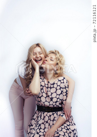 mother with teen daughter together posing happy smiling isolated on white background with copyspace, lifestyle people concept mother with teen daughter together posing happy smiling isolated on white background with copyspace, lifestyle people concept 72116121