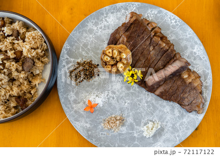 wagyu beef well done steak in plate 72117122
