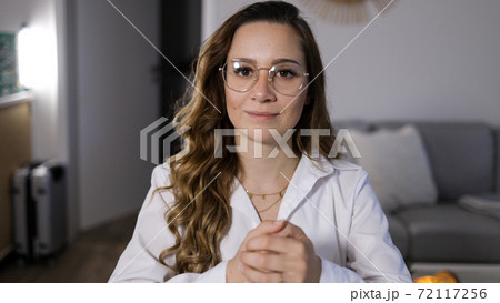 Young woman attends a conference call Young woman attends a conference call 72117256