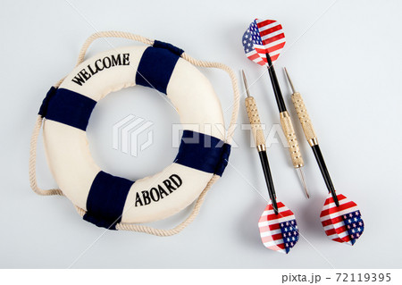 Three darts with the flag of the United States of America and lifebuoy Three darts with the flag of the United States of America and lifebuoy 72119395