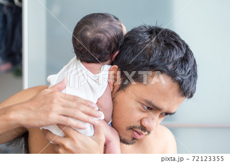 Infant baby boy belching after drink breast milk Infant baby boy belching after drink breast milk 72123355