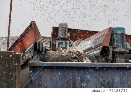 Moving conveyor transporter on Modern waste recycling processing plant. Separate and sorting garbage collection. Recycling and storage of waste for further disposal. Moving conveyor transporter on Modern waste recycling processing plant. Separate and sorting garbage collection. Recycling and storage of waste for further disposal. 72123732