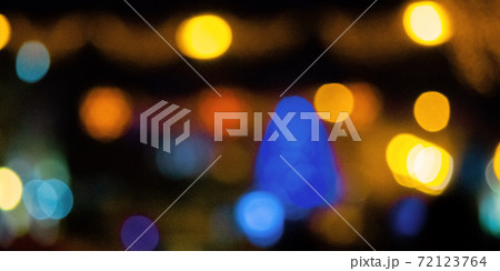 winter holidays background. garlands on the street with bokeh effect 72123764