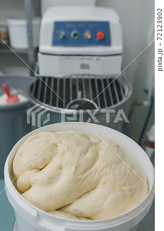 Fresh dough ready for baking in plastic basket. Preparation of bakery products Fresh dough ready for baking in plastic basket. Preparation of bakery products 72123902
