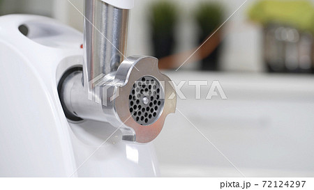 Ergonomic nut on meat grinder head for providing quality mince from meat. Electric mincer machine for minced meat per minute, make sausages, mashed berries, squeeze juice. 72124297