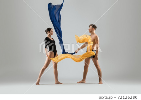 Young couple of dancers with colorful cloth Young couple of dancers with colorful cloth 72126280