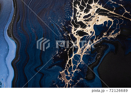 Acrylic Fluid Art. Liquid gold spill on dark blue waves of abstract ocean. Marble effect background or texture 72126689