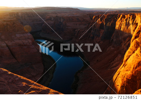 Beautiful view of the Horseshoe Bend, Arizona, under warm sunset light. Beautiful view of the Horseshoe Bend, Arizona, under warm sunset light. 72126851