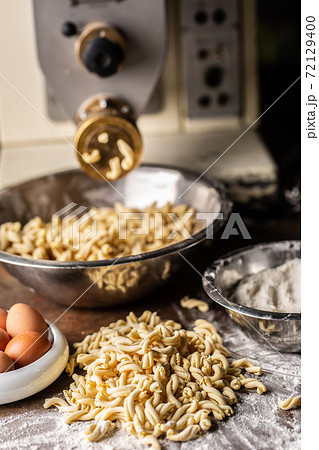 Fussili pasta dough freshly made by a machine 72129400