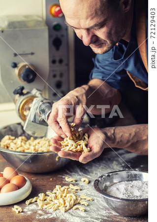 Freshly made twisted shape Italian pasta in the hands of a small producer Freshly made twisted shape Italian pasta in the hands of a small producer 72129403