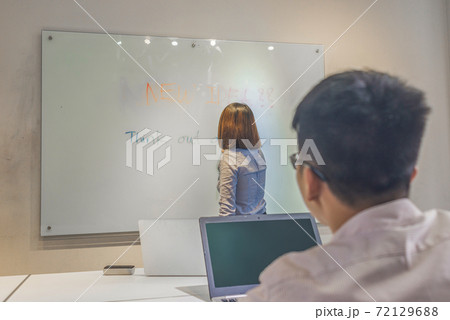 The man using laptop while attending meeting in conference room The man using laptop while attending meeting in conference room 72129688