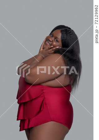 African american young woman in red underwear smiling and posing 72129962