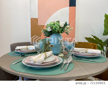 Modern interior design of dining table with cozy decoration Modern interior design of dining table with cozy decoration 72130003