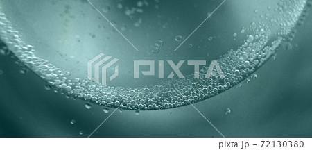 abstract tidewater green background with oil circles . water drops close up . oil bubbles in the water macro. banner 72130380