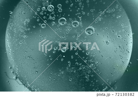 abstract tidewater green background with oil circles . water drops close up . oil bubbles in the water macro. 72130382