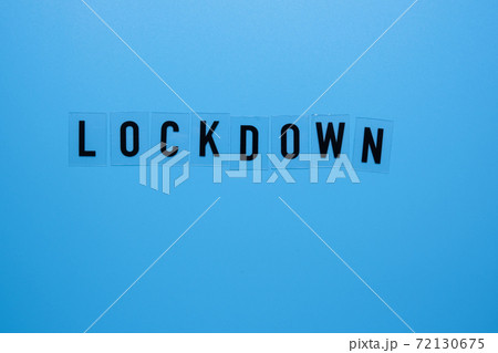 The word lockdown on a blue background close-up. The word lockdown on a blue background close-up. 72130675