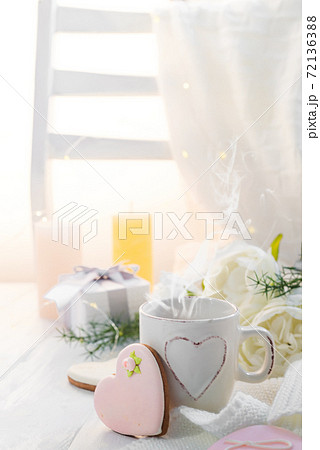 Valentine's day romantic breakfast wuth gingerbread Heart with icing and cup of coffe Valentine's day romantic breakfast wuth gingerbread Heart with icing and cup of coffe 72136388