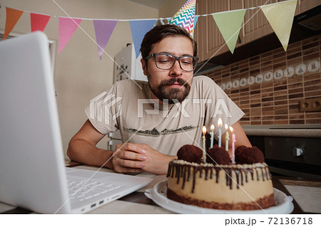 Man celebrating birthday online in quarantine time. Man celebrating birthday online in quarantine time. 72136718