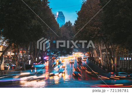 Tbilisi, Georgia. Evening City Traffic On Shota Rustaveli Avenue In City Center. Famous Street In Night Lighting Tbilisi, Georgia. Evening City Traffic On Shota Rustaveli Avenue In City Center. Famous Street In Night Lighting 72136781
