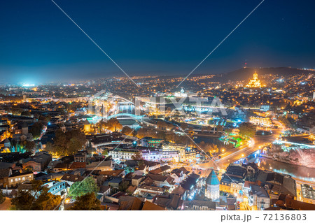 Tbilisi, Georgia. Elevated Rooftop View Of Famous Landmarks In Night Illuminations. Georgian Capital Skyline Cityscape Tbilisi, Georgia. Elevated Rooftop View Of Famous Landmarks In Night Illuminations. Georgian Capital Skyline Cityscape 72136803