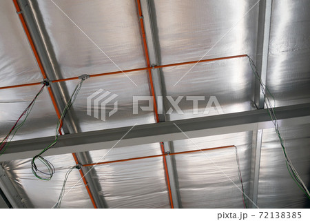 KLANG, MALAYSIA -MARCH 6, 2020: Electrical services, conduit and wiring above the ceiling. Install by electrician at the roofing trusses. 72138385