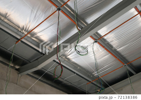 KLANG, MALAYSIA -MARCH 6, 2020: Electrical services, conduit and wiring above the ceiling. Install by electrician at the roofing trusses. 72138386