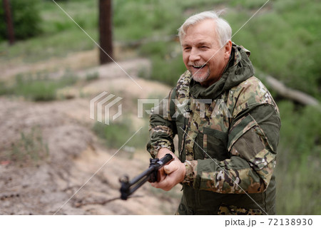 Happy Hunter Walks with Shotgun Lifestyle Concept. Happy Hunter Walks with Shotgun Lifestyle Concept. 72138930