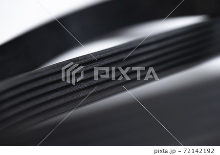 New belt for automobile poly-V-belt electricity generator. Macro close-up blank for background New belt for automobile poly-V-belt electricity generator. Macro close-up blank for background 72142192
