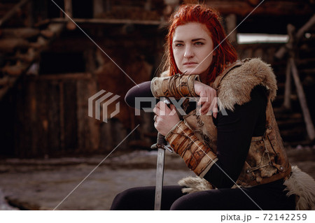 Viking woman . Reconstruction of a medieval scene Viking woman . Reconstruction of a medieval scene 72142259