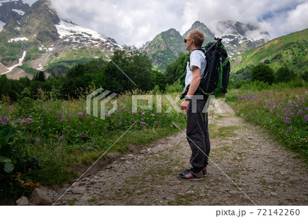 Man with backpack hiking in mountains. Travel Lifestyle success concept 72142260
