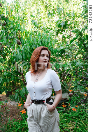 Happy redhair young woman portrait, summer outdoors 72142265