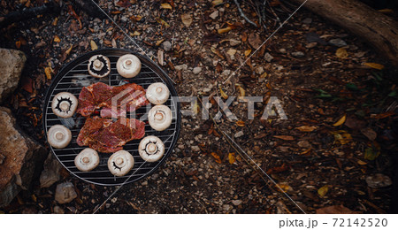 Beef steaks on grill outdoor near river Beef steaks on grill outdoor near river 72142520