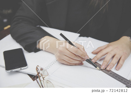woman ruler in hand 72142812