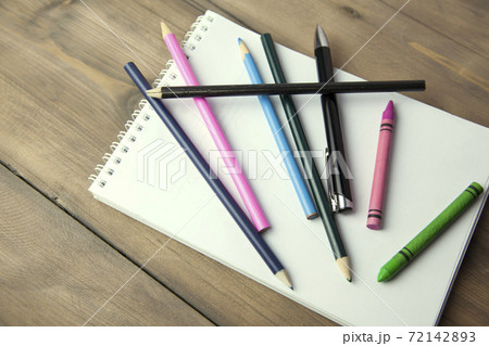 notebook, pencils and pen on table notebook, pencils and pen on table 72142893