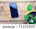 phone, pencil and flower 72142955
