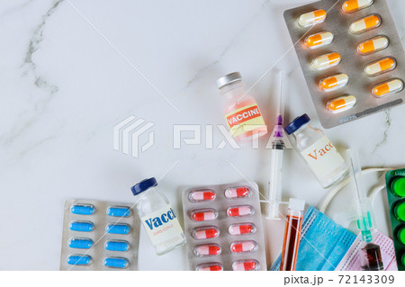 Pharmaceutical medicine pills, tablets and capsules on coronavirus vacine bottle SARS-COV-2 COVID-19 Pharmaceutical medicine pills, tablets and capsules on coronavirus vacine bottle SARS-COV-2 COVID-19 72143309